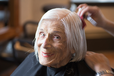 Senior woman getting a haircut